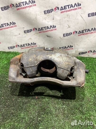 Суппорт тормозной передний левый Nissan Note E11