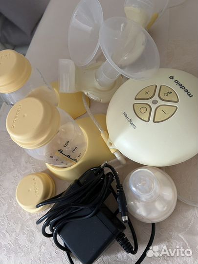 Молокоотсос medela электрический