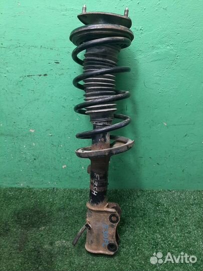 Стойка амортизатора передняя левая Suzuki Grand V