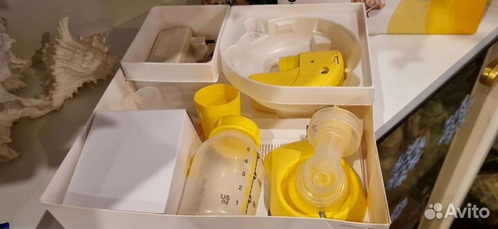 Молокоотсос medela электрический