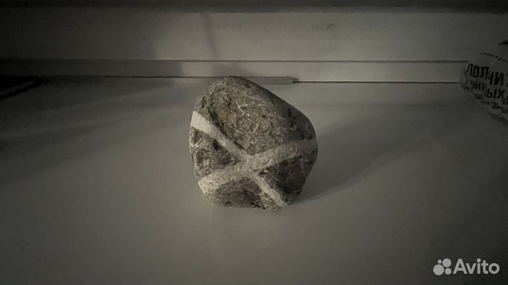 Камень с символом 