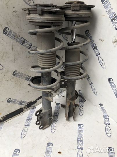Стойка амортизатора передняя nissan tiida