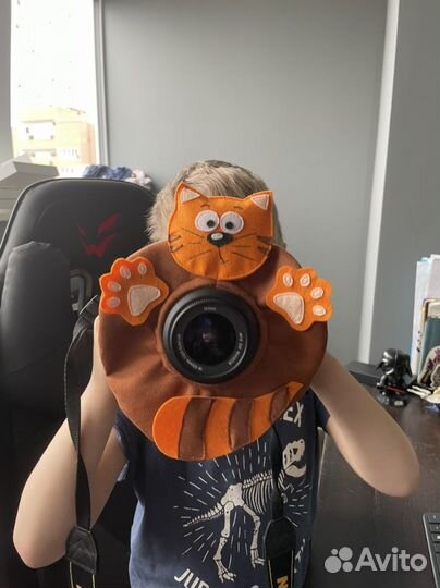 Игрушка на объектив фотоаппарата