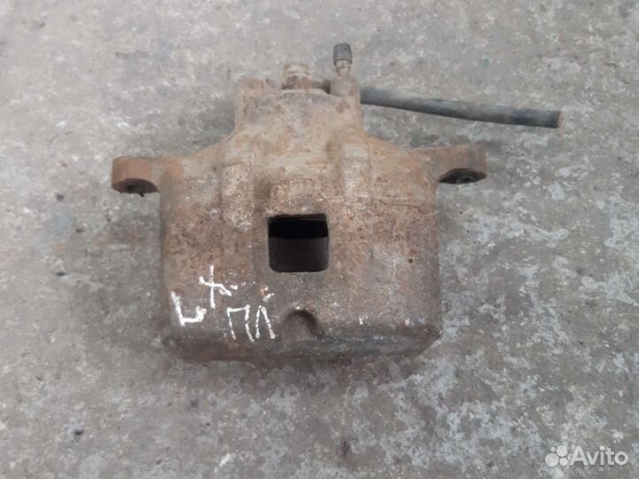 Супорт передний левый mitsubishi lancer 10