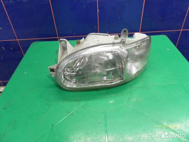 Фара левая Ford Escort