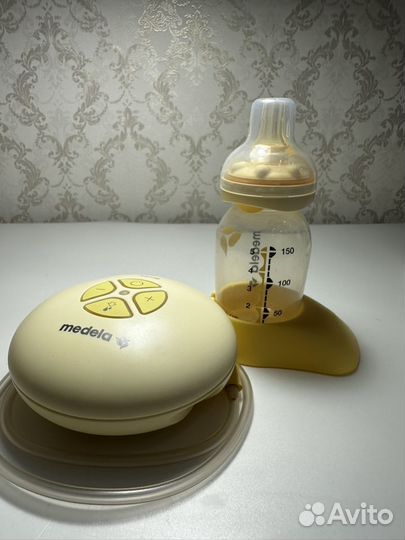 Молокоотсос medela swing