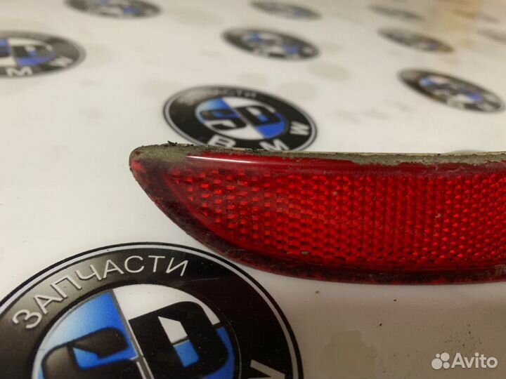 Отражатель бампера левый BMW F07