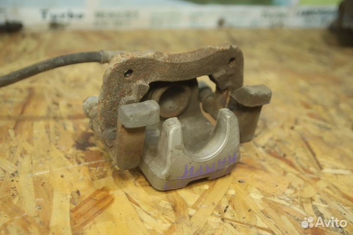 Суппорт тормозной зад Тойота Камри 40