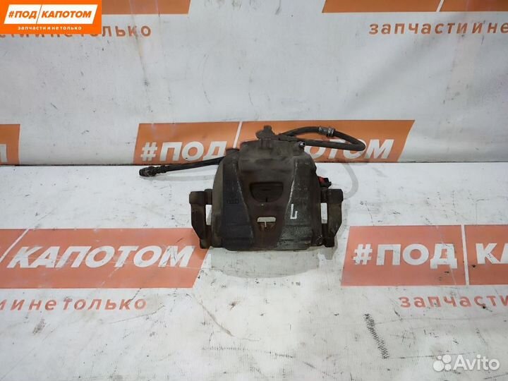 Суппорт тормозной передний левый Volkswagen Tiguan