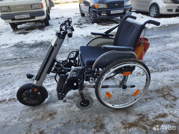 Электрическая приставка с инвалидной коляской