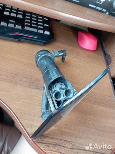 Форсунка омывателя фар левая Nissan Tiida