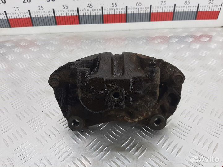 Суппорт передний левый Nissan Navara D22 рест