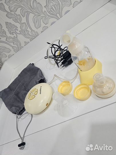 Молокоотсос medela электрический