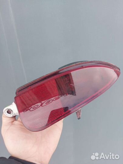 Отражатель (катафот)бампера левый Opel Corsa C