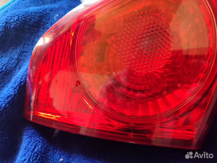 Фонарь задний левый оригинал тайота королла 2007
