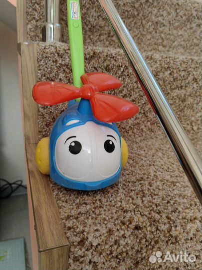 Игрушка каталка с ручкой вертолет