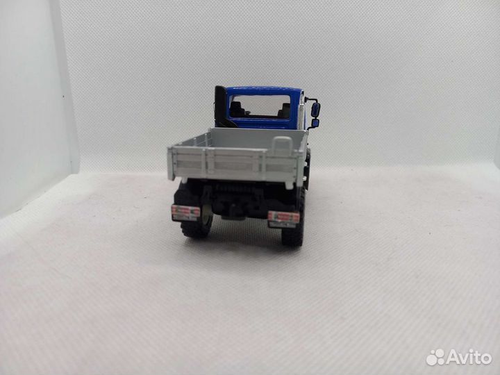 Mercedes Unimog U400,бортовой 1:43 Welly