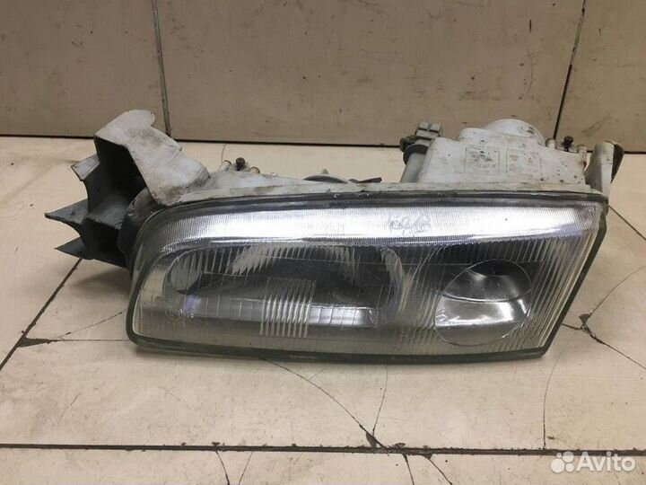 Фара левая Mazda 626