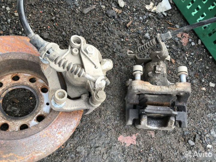 Суппорт тормозной задний Skoda Octavia A7