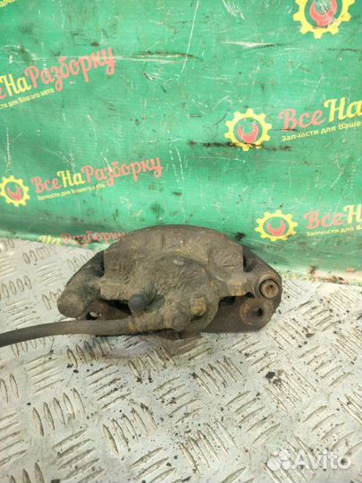 Суппорт передний левый Mazda 626 GF 1.8 Л 1993