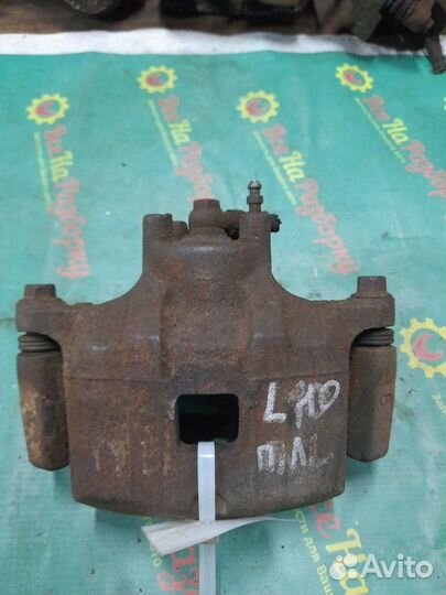 Суппорт передний левый Mitsubishi Lancer 10 седан