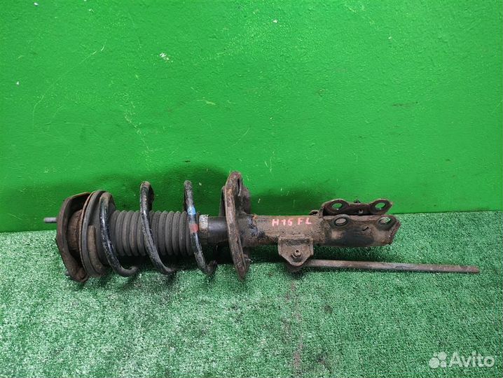 Стойка амортизатора передняя левая Toyota Auris E