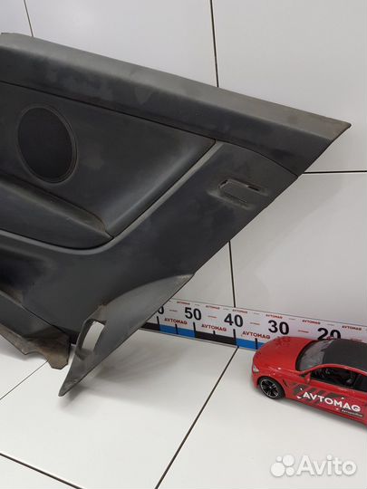 Обшивка салона задняя правая (Opel Astra)