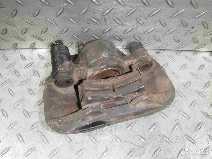 Суппорт тормозной передний левый Mazda Demio