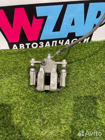 Суппорт тормозной задний левый Buick Encore GX