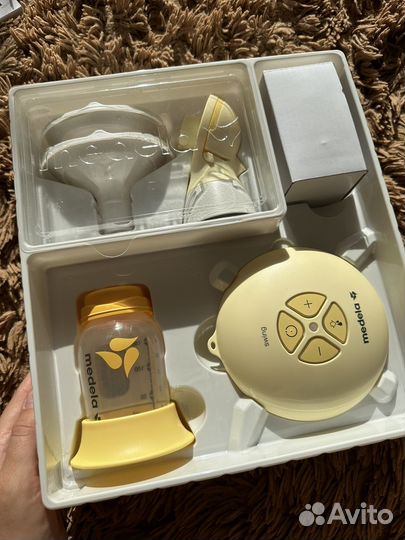 Электронный молокоотсос medela