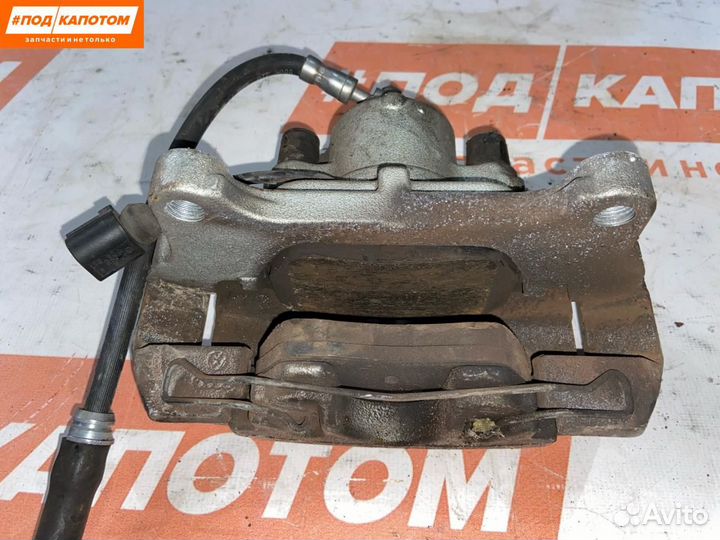 Суппорт тормозной передний левый Volkswagen Caddy