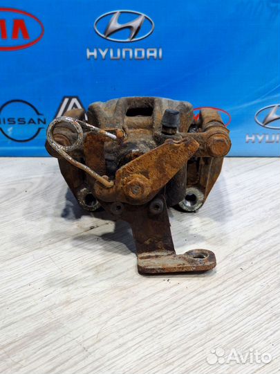 Суппорт тормозной задний geely emgrand X7 Лев