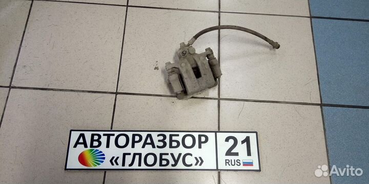 Суппорт тормозной задний левый Kia Sportage 3