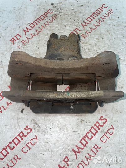 Суппорт тормозной передний левый Mitsubishi Lancer