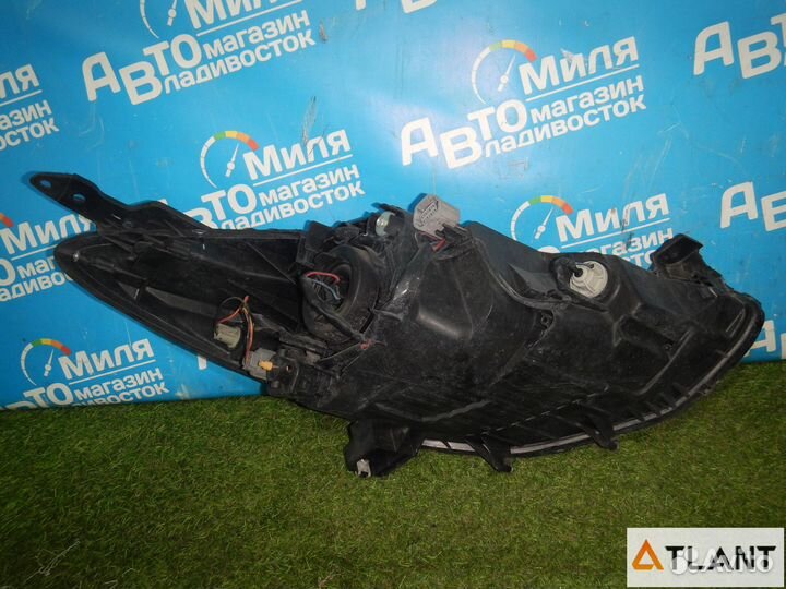 Фара левая mazda demio