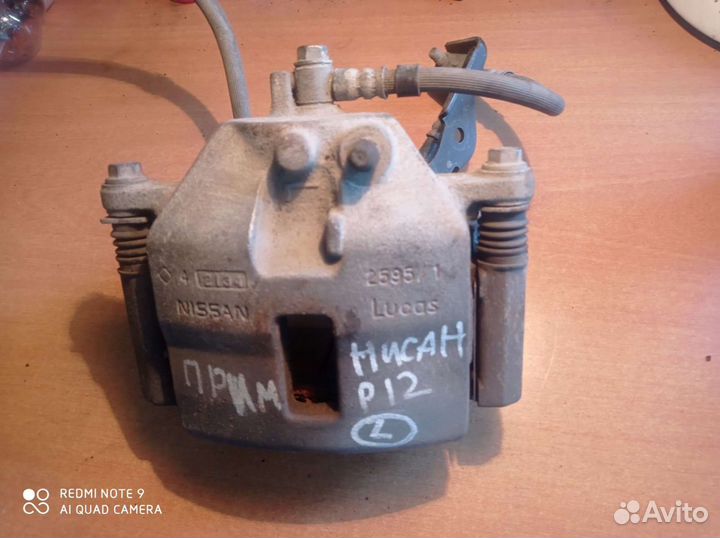 Суппорт тормозной передний левый Nissan PrimeraP12