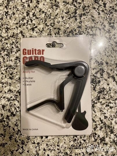 Каподастр гитара