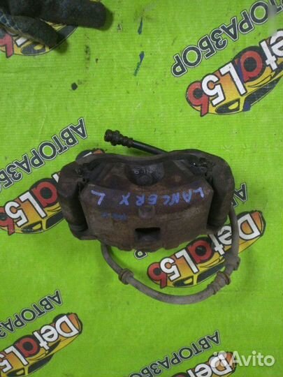 Суппорт тормозной передний левый Mitsubishi Lancer