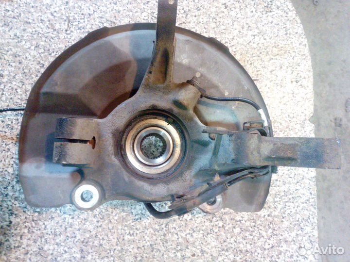 Кулак поворотный левый Mitsubishi Outlander XL