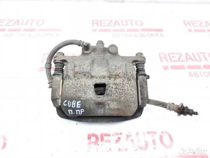 Суппорт тормозной передний правый Nissan Cube Z10