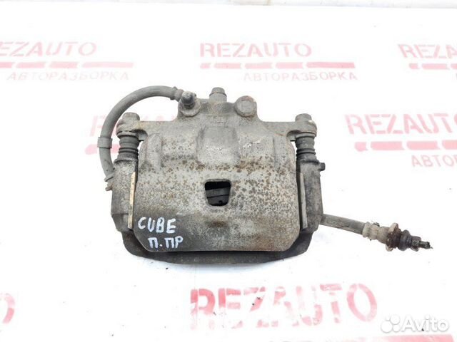 Суппорт тормозной передний правый Nissan Cube Z10