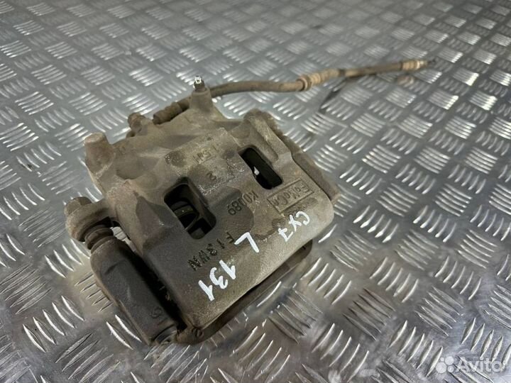 Суппорт тормозной передний левый Мазда сх7