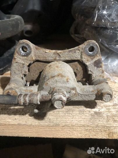 Суппорт тормозной задний левый Chevrolet Lacetti