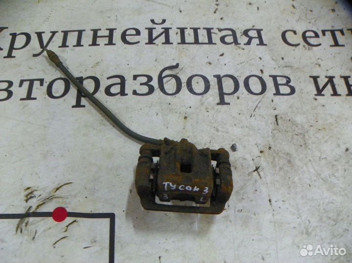 Суппорт тормозной задний левый Hyundai Tucson