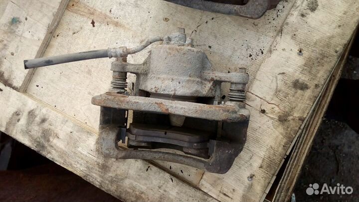 Суппорт тормозной передний Левый Хендай Солярис