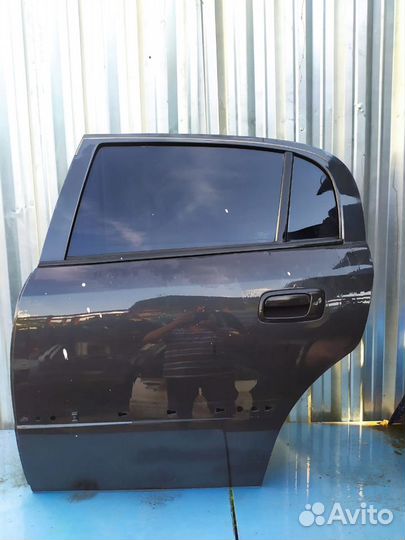 Дверь зад. лев. Opel Astra G