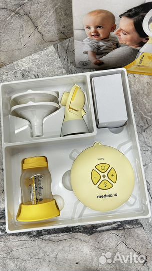 Молокоотсос medela электрический