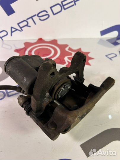 Суппорт тормозной задний левый Vw Passat B7 1.4