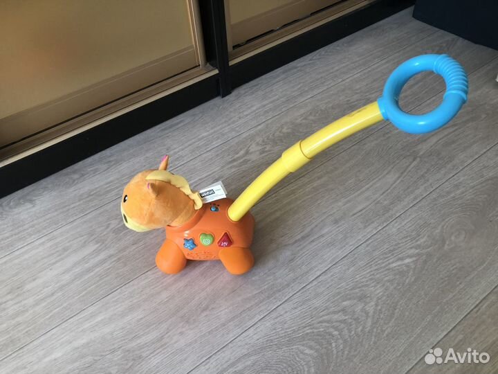 Игрушка каталка Музыкальная