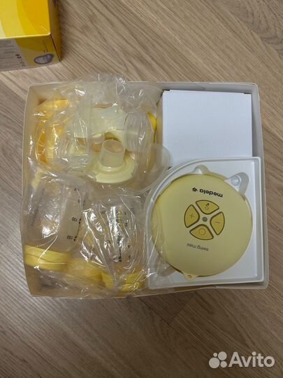 Молокоотсос medela swing maxi & calma